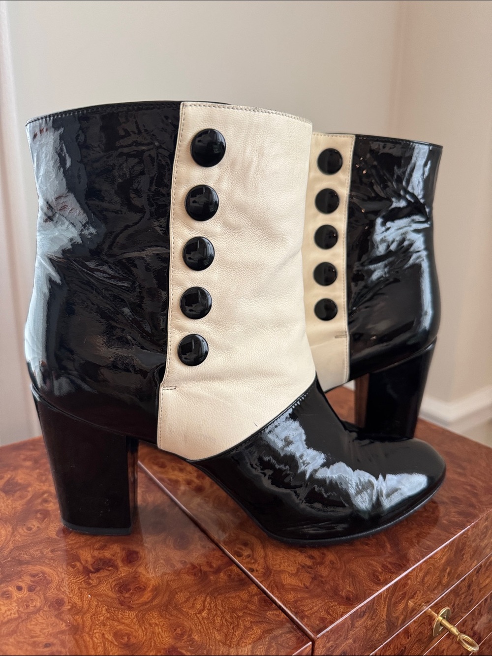 CHANEL Black and Cream Patent Leather Button-Front Ankle Boots